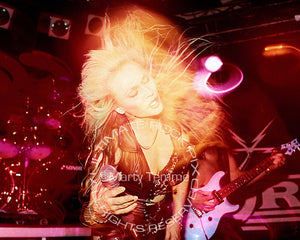 Photo of Doro Pesch in concert in 1990 by Marty Temme