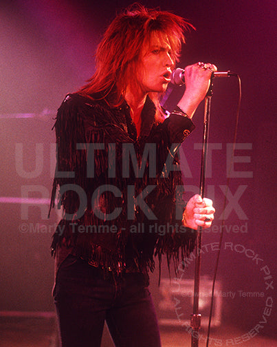 Photo of vocalist Shane of Electric Angels in concert in 1988 by Marty Temme