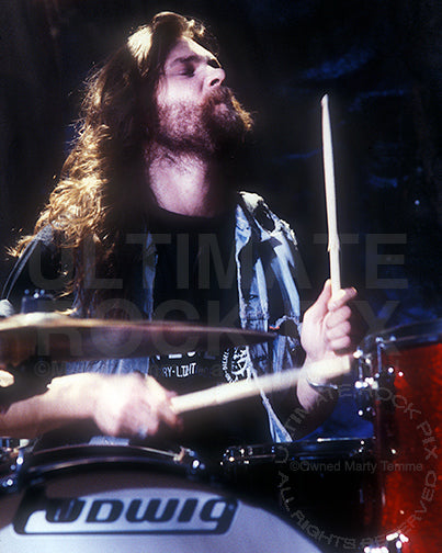 Photo of Niklas Sigevall of Electric Boys playing drums in 1992 by Marty Temme