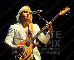 Photo of Greg Lake of Emerson, Lake and Palmer and King Crimson in concert in 1978 by Marty Temme