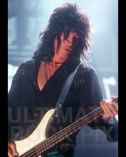 Photo of bass player Eric Stacy of Faster Pussycat in 1989 by Marty Temme