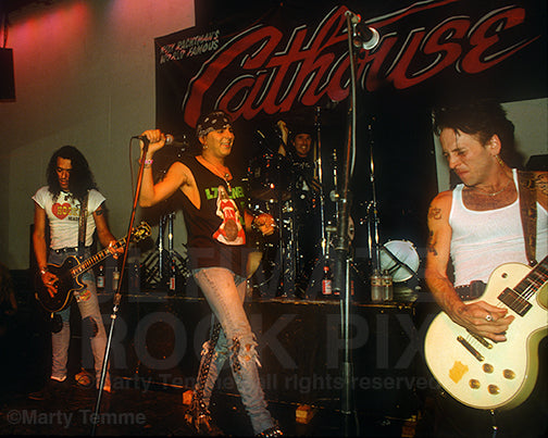 Photo of Stephen Pearcy, Taime Downe and Tracii Guns in 1991 by Marty Temme