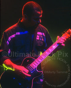 Photo of guitarist Tony Rombola of Godsmack in concert by Marty Temme