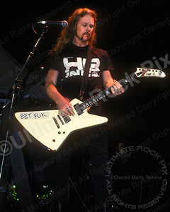 Photo of James Hetfield of Metallica performing onstage in 1989 by Marty Temme