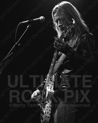Black and white photo of Jerry Cantrell playing a Les Paul in concert in 2002 by Marty Temme