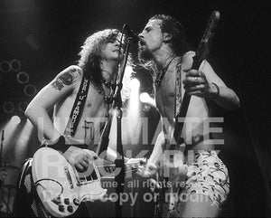 Black and white photo of Duff McKagan of Guns N' Roses and Jerry Cantrell of Alice in Chains in concert in 1991 by Marty Temme