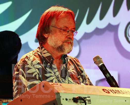 Photo of Jim Cox playing keyboards in concert in 2012 by Marty Temme