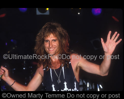 Photo of singer John Waite of Bad English in concert in 1989 by Marty Temme