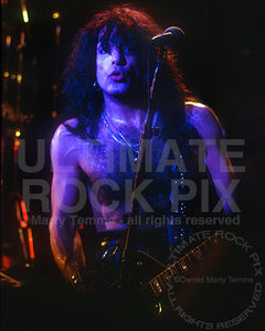 Photo of Paul Stanley of Kiss in concert in 1992 by Marty Temme