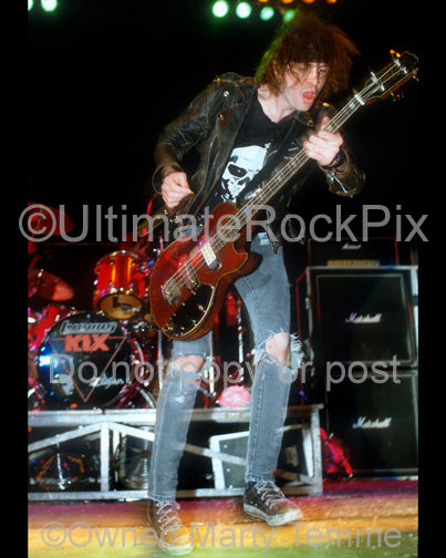 Photo of bass player Donnie Purnell of Kix in concert in 1989 by Marty Temme