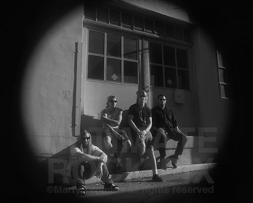 Black and white photo of Josh Homme, John Garcia, Scott Reeder and Alfredo Hernandez of Kyuss during a photo shoot in 1994 by Marty Temme