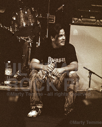 Sepia tint photo of John Garcia of Kyuss during soundcheck in 1994 by Marty Temme