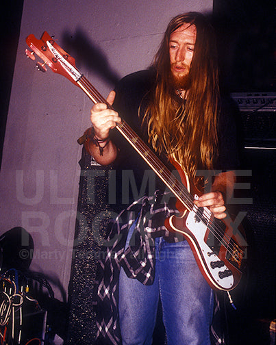 Photo of Scott Reeder of Kyuss playing a Rickenbacker bass in concert in 1994 by Marty Temme