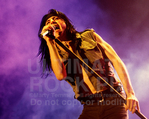 Photo of singer Phil Lewis of L.A. Guns in concert in 1991 by Marty Temme