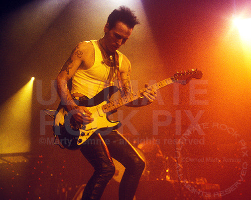Photo of Tracii Guns of L.A. Guns playing a Fender Stratocaster in 1991 in by Marty Temme