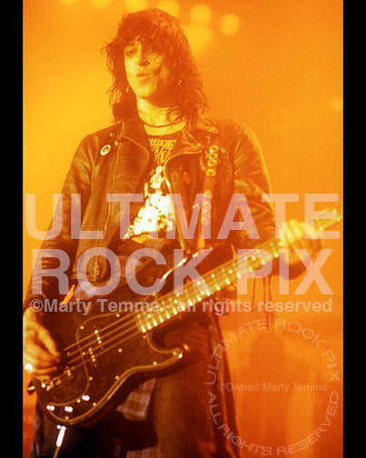 Photo of bassist Kelly Nickels of L.A. Guns performing in concert in 1991 by Marty Temme