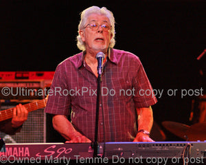 Photo of blues legend John Mayall playing keyboard in concert in 2008 by Marty Temme