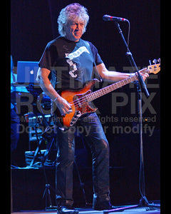 Photo of John Lodge of The Moody Blues playing bass in concert by Marty Temme