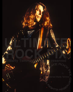 Photo of bassist Paul Barker of Ministry in concert in 1992 by Marty Temme