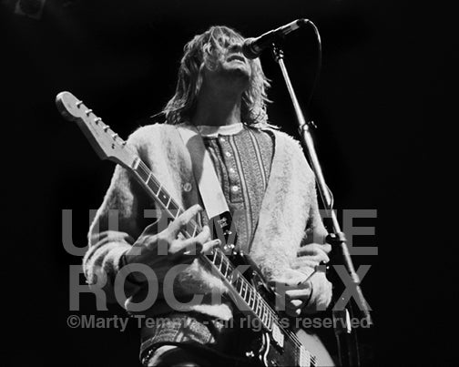 Photo of Kurt Cobain of Nirvana playing his 1965 Fender Jaguar in 1991 by Marty Temme