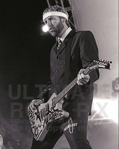 Photo of guitarist Tom Dumont of No Doubt in concert in 2004 by Marty Temme