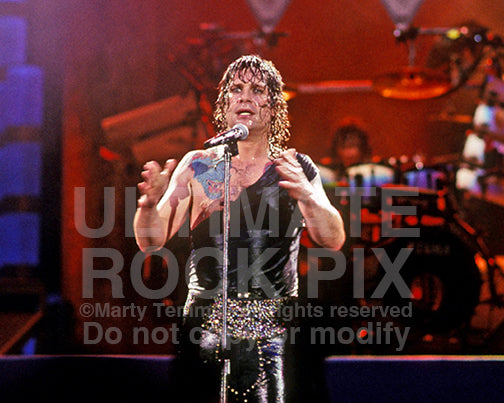 Photo of Ozzy Osbourne performing onstage in 1989 by Marty Temme