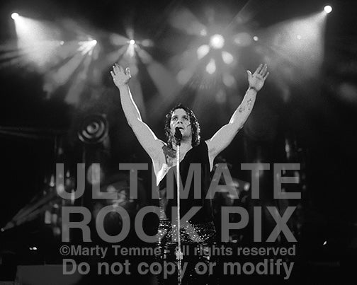 Black and white photo of singer Ozzy Osbourne performing in concert in 1989 by Marty Temme