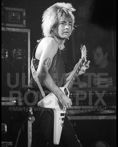 Photo of guitarist Carlos Cavazo of Quiet Riot in concert in 1983 by Marty Temme