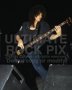 Photo of bassist Eddie Jackson of Queensryche in concert in 1989 by Marty Temme
