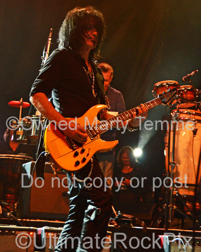 Photo of guitar player Robert Sarzo in concert in 2013 by Marty Temme