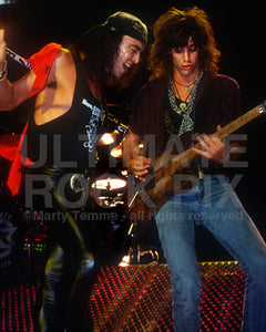 Photo of Stephen Pearcy and Warren DeMartini of Ratt in concert in 1988 by Marty Temme