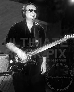 Black and white photo of Reeves Gabrels playing a Parker Fly guitar in concert&nbsp; by Marty Temme