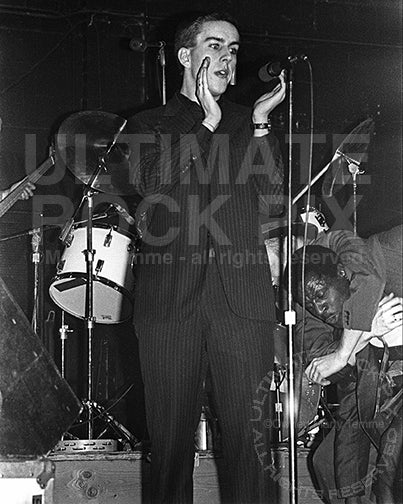 Photo of Terry Hall of The Specials in concert in 1980 by Marty Temme