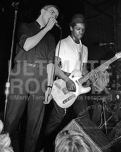 Photo of Terry Hall and Lynval Golding of The Specials in concert in 1980 by Marty Temme