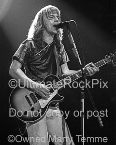 Photo of Tommy Shaw of Styx playing a Gibson Les Paul in concert in 1979 by Marty Temme