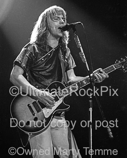 Photo of Tommy Shaw of Styx playing a Gibson Les Paul in concert in 1979 by Marty Temme