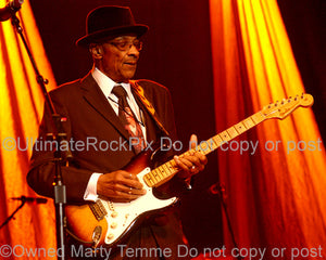 Photo of guitarist Hubert Sumlin playing his Stratocaster in concert by Marty Temme