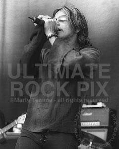 Black and white photo of Christopher Hall of Stabbing Westward in concert by Marty Temme