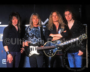 Photo of Randy Gregg, Scott Gorham, John Sykes and Michael Lee of Thin Lizzy during a photo shoot in 2004 by Marty Temme