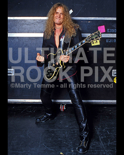 Photo of guitarist John Sykes of Thin Lizzy during a photo shoot in 2004 by Marty Temme