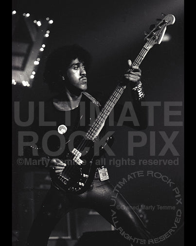 Photo of musician Phil Lynott of Thin Lizzy in concert in 1977 by Marty Temme