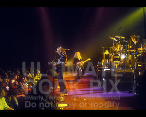 Photo of Scott Gorham, John Sykes and Michael Lee of Thin Lizzy in concert by Marty Temme