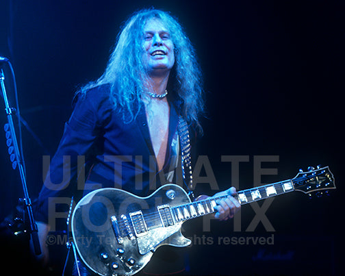 Photo of John Sykes of Thin Lizzy performing in concert in 2004 by Marty Temme