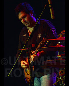Photo of Photo of Kirk McKim of Pat Travers in concert in 2009 by Marty Temme
