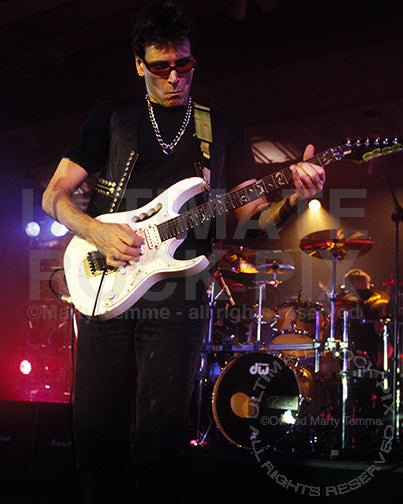 Photo of guitar player Steve Vai in concert in 1998 by Marty Temme