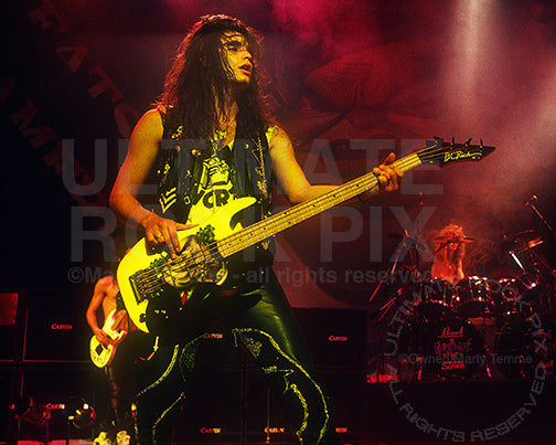 Photo of bass player Jerry Dixon of Warrant in concert in 1989 by Marty Temme