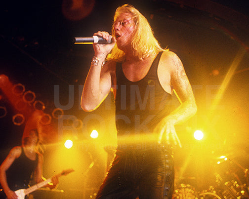 Photo of singer Jani Lane of Warrant in concert in 1992 by Marty Temme