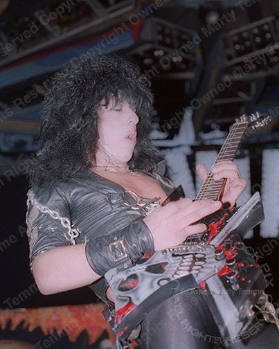 Photo of Randy Piper of W.A.S.P. in concert in 1985 by Marty Temme