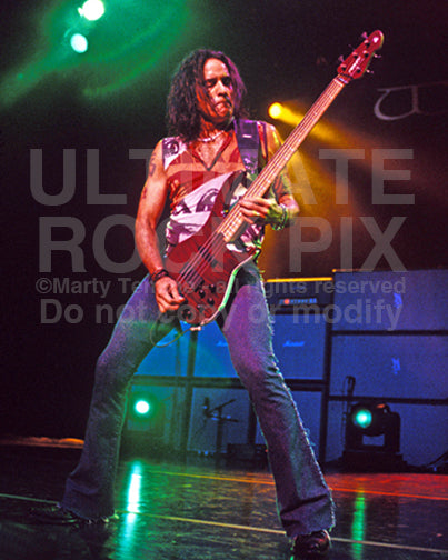 Photo of bassist Marco Mendoza of Whitesnake in concert by Marty Temme