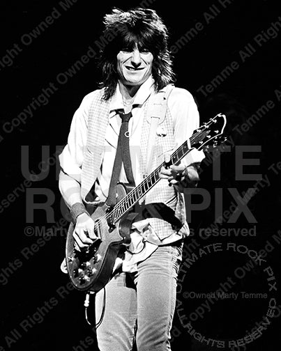 Photo of guitarist Ron Wood of The Rolling Stones playing a Zemaitis guitar in concert in 1979 by Marty Temme